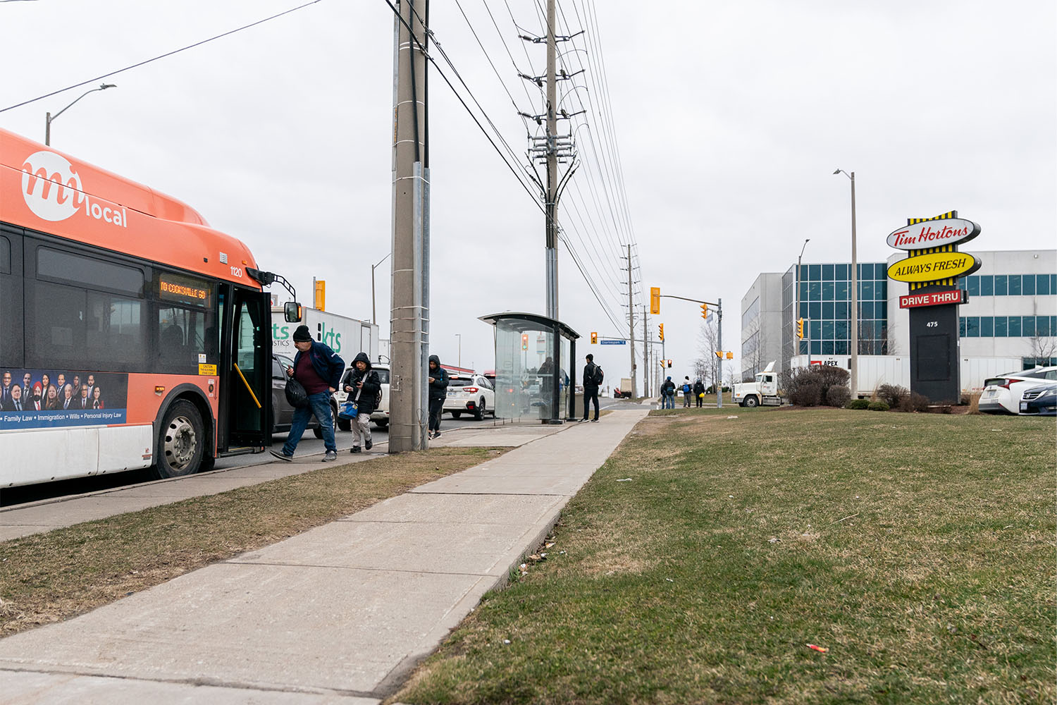 Commuters at the bus stop on Courtney Park Dr. E., not far from the Sterigenics facility in Mississauga.