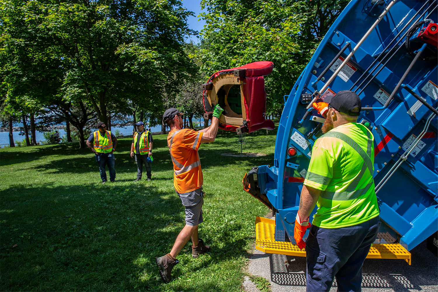 City workers remove personal items during the eviction process at Marilyn Bell Park. 