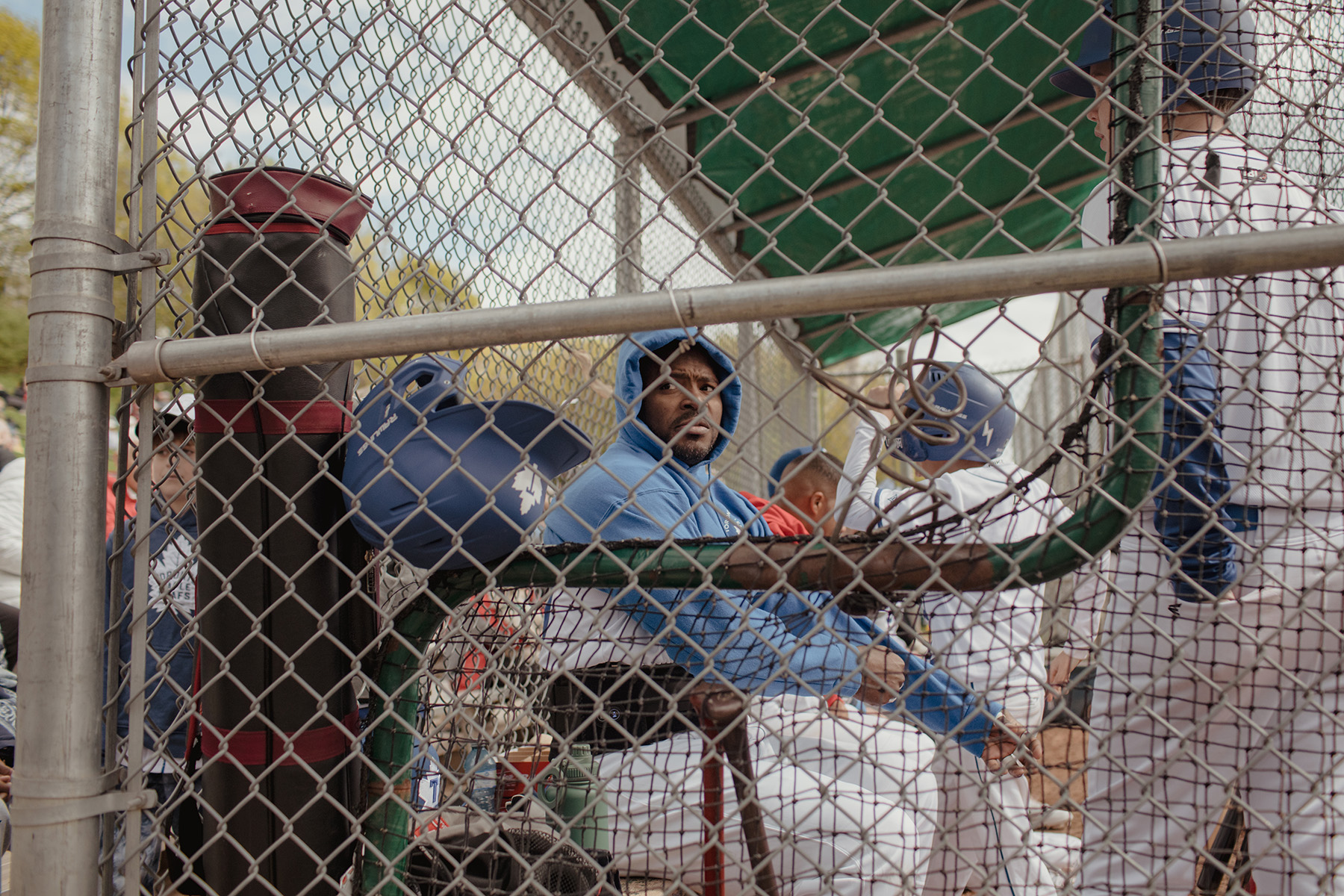 Yasiel Puig looks out from the dugout at Christie Pitts.