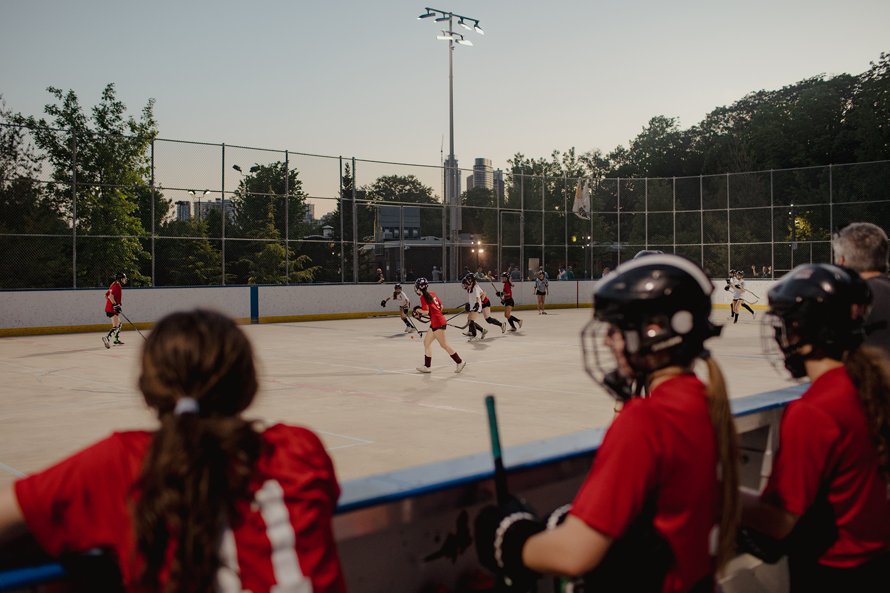 Athletes look on as their teammates play at Riverdale Park East