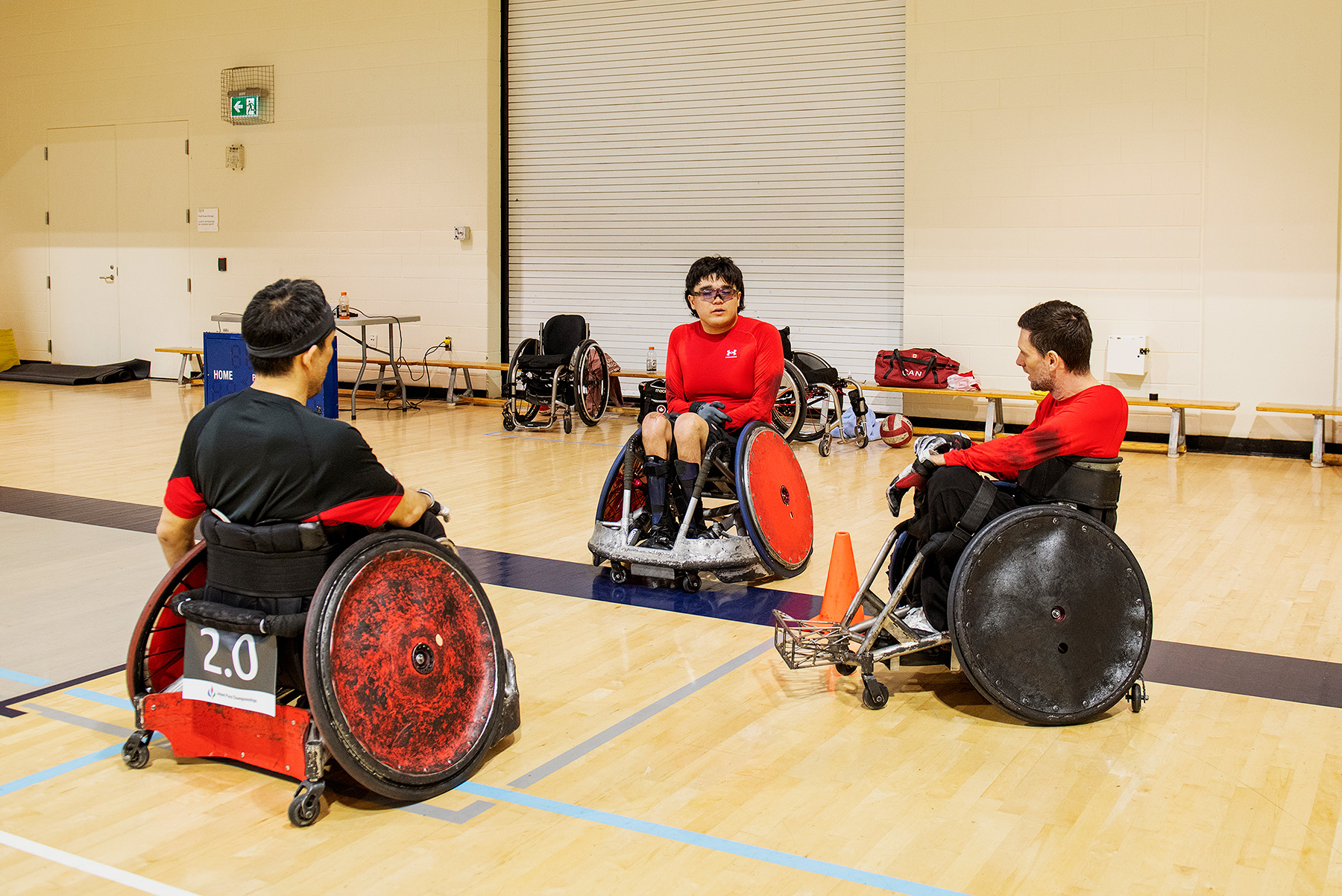 Rio Kanda Kovac speaks with coach Travis Murao, left, and teammate Eric Rodrigues. 
