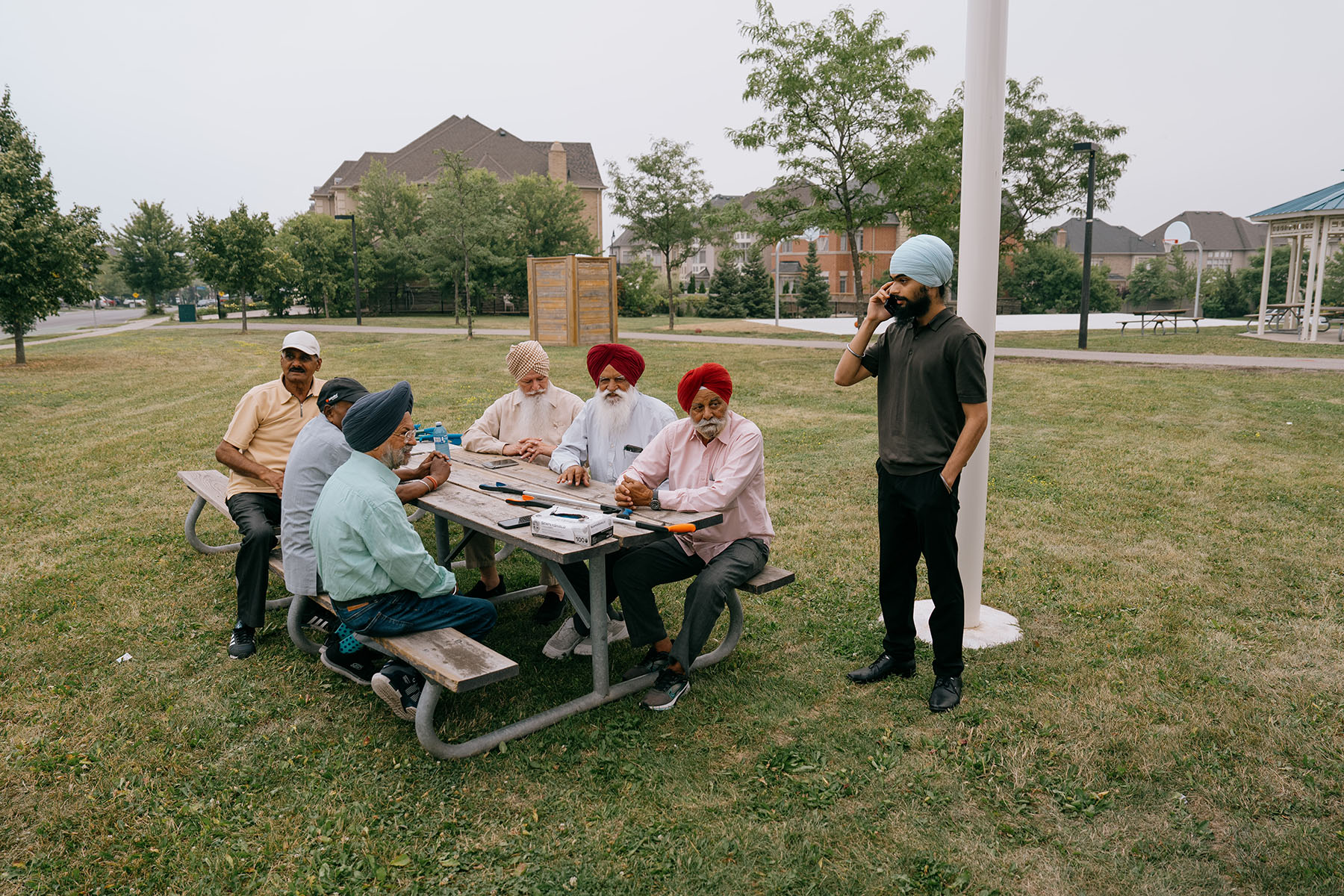 Rajbalinder Ghatoura meets with seniors participating in a community cleanup at Luongo Park in Brampton.