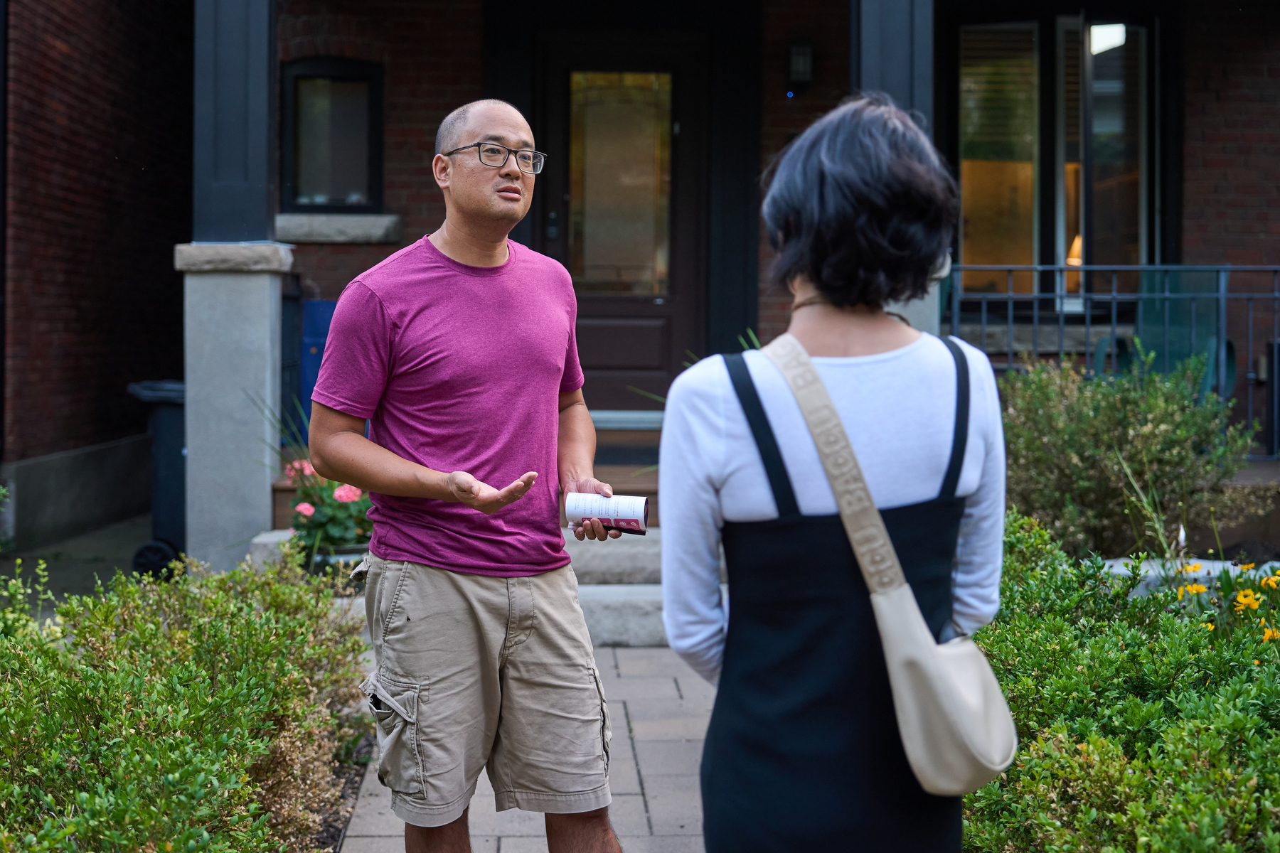 McNally speaks with residents while canvassing near Keele subway station in Parkdale—High Park.