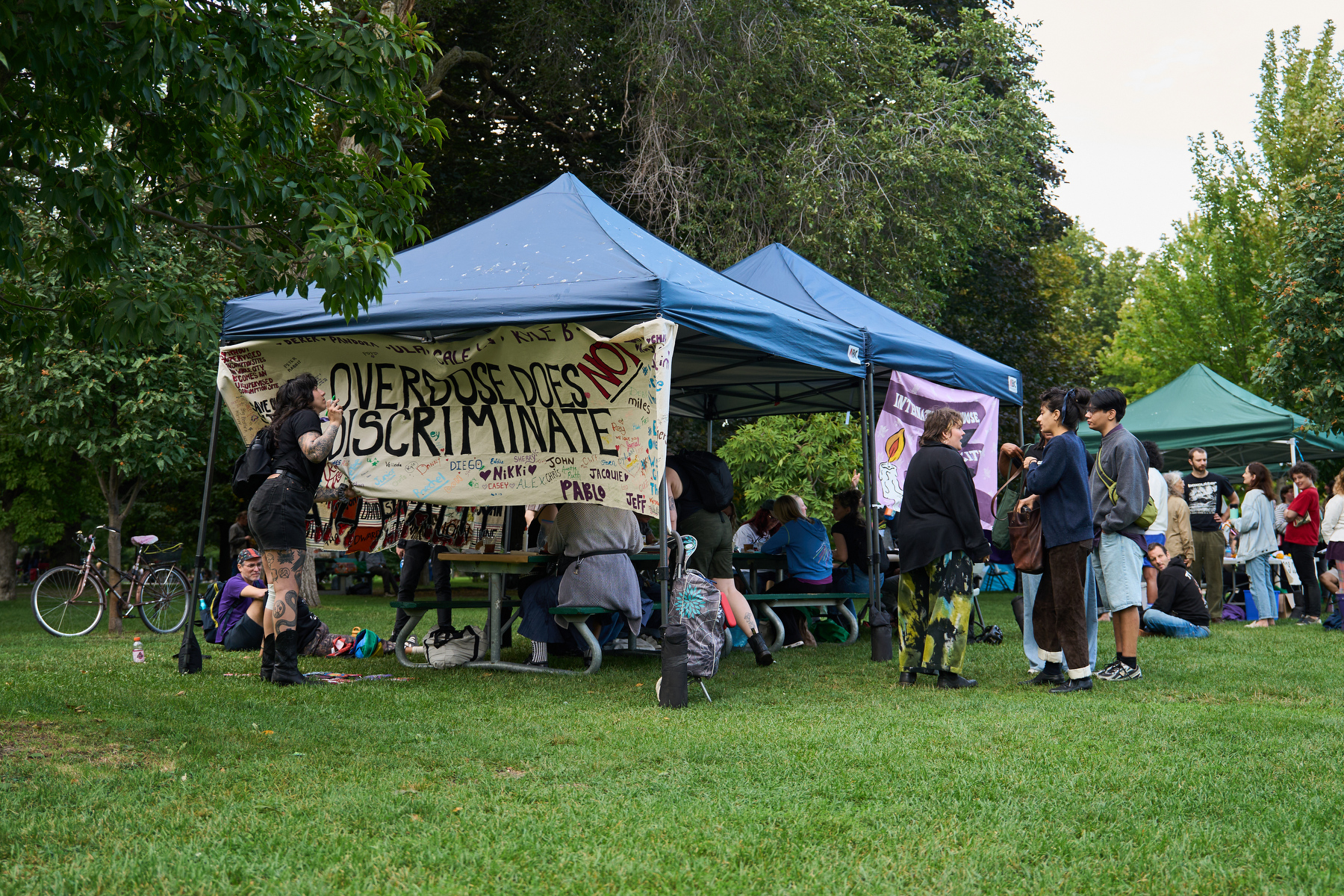Attendees decorate naloxone kits for a patchwork art piece at an overdose awareness event at Trinity Bellwoods Park in August.