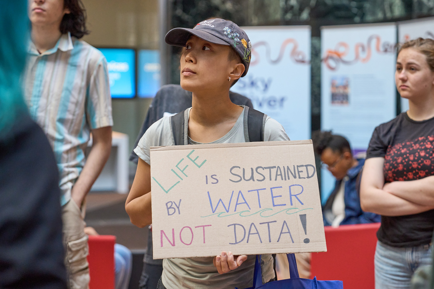 Protesters wait to enter a presentation at Mississauga city hall outlining the proposed study for the planned data centre.