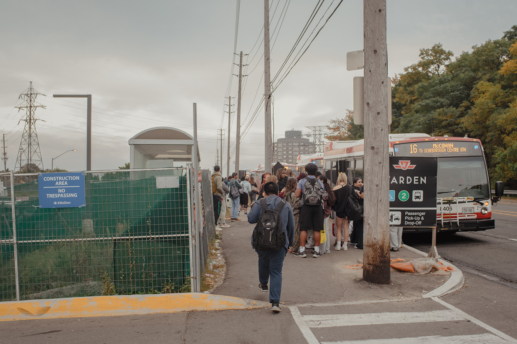 Left, Scarborough Southwest candidate Kevin Rupasinghe canvasses at Warden station during morning rush hour on a Wednesday in September. Right, transit riders wait for the bus on the east side of Warden Avenue.