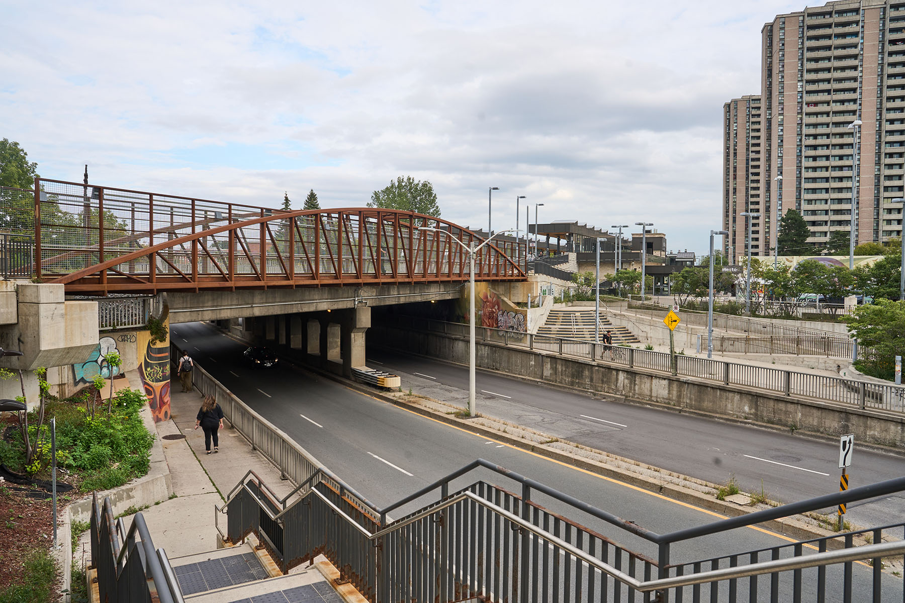 Left, Mount Dennis station on the Eglinton Crosstown LRT line. Right, a bridge over Lawrence Avenue West leads to Weston GO and UP Express stations.