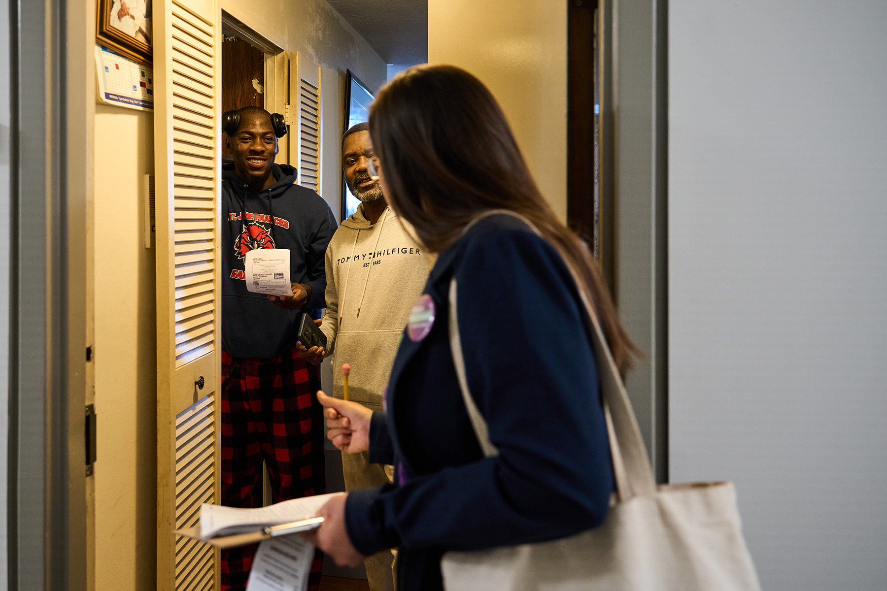 Left, Padovani and volunteers canvas in an apartment building near Weston Road and Lawrence Avenue West, where Padovani helped organize a rent strike as co-chair of the York South-Weston Tenants Union in 2023. Right, Padovani explains how to fill out a ballot to a young constituent who plans to vote for the first time.