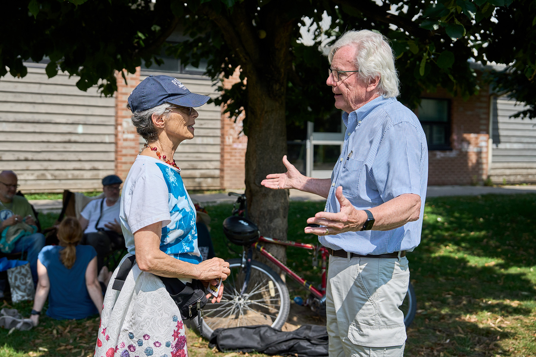 Saxe speaks with a constituent at a meet-and-greet with constituents at Withrow Park in September. Photo by Nic Hotchkiss / The Local